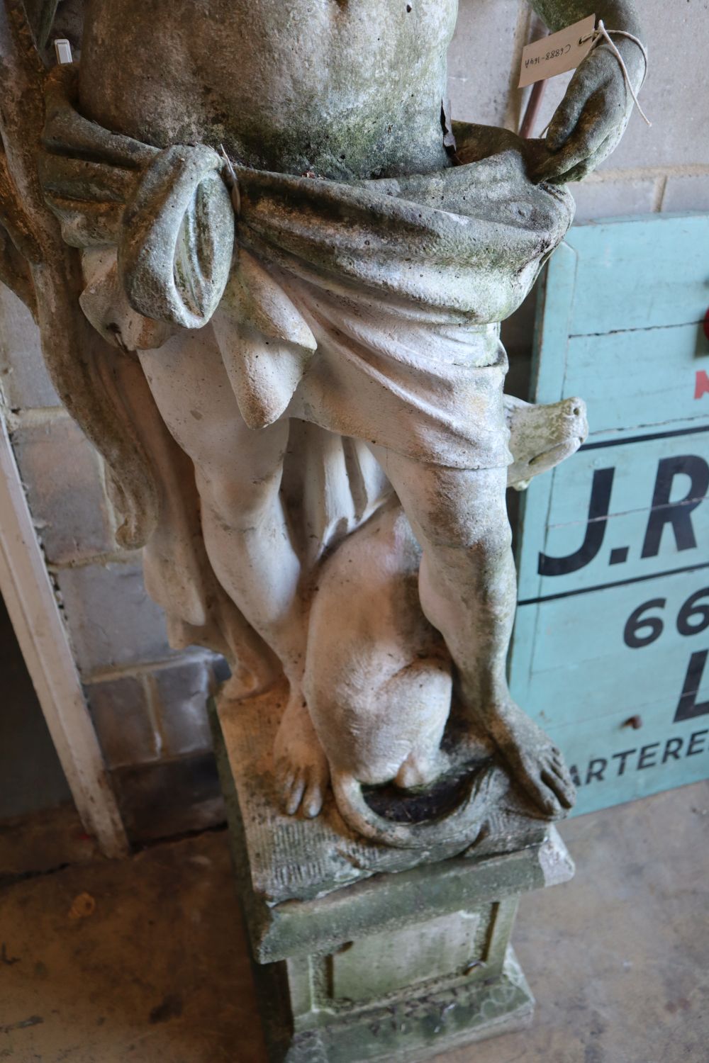 A reconstituted stone garden statue of an archer and hound, height 190cm